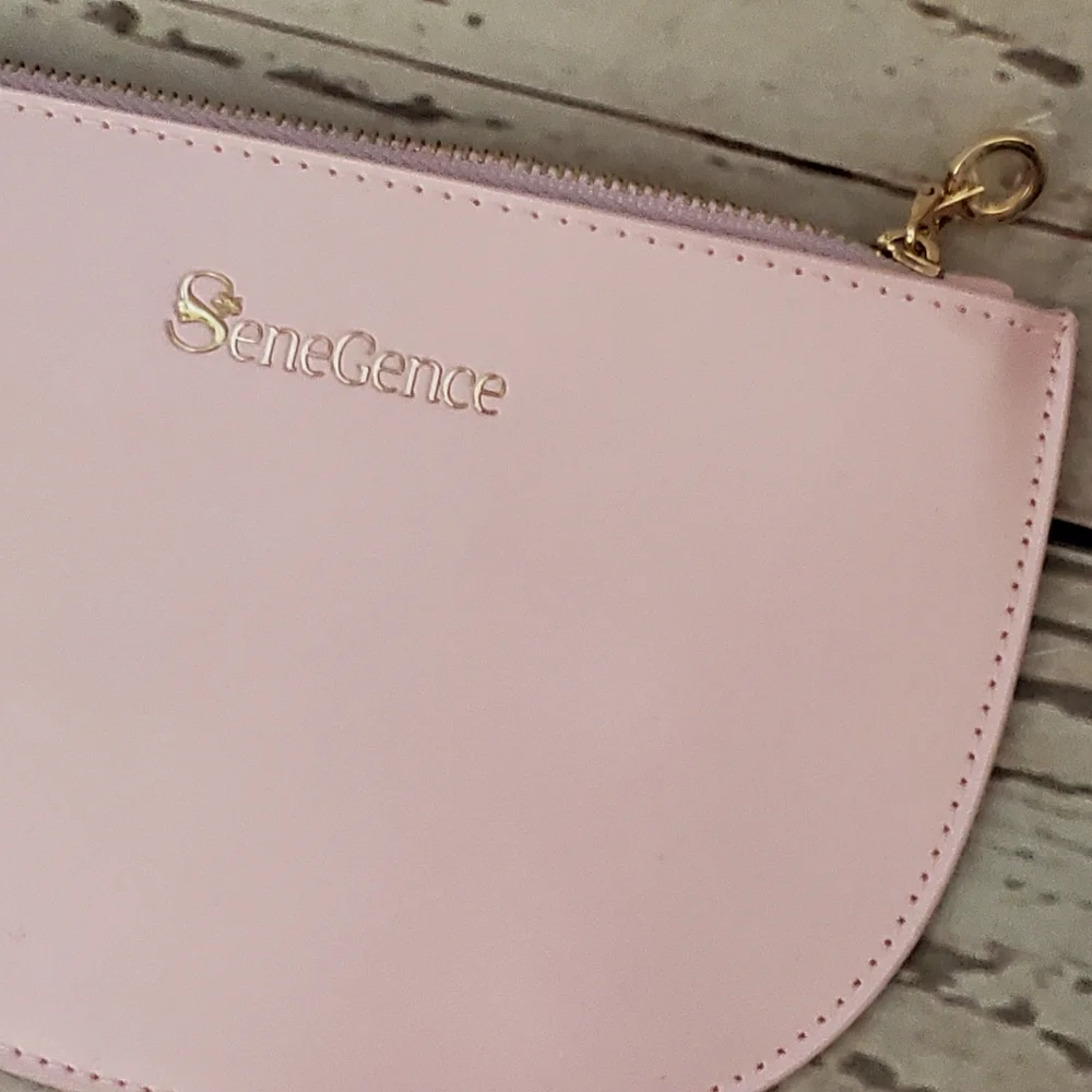 SeneGence pearlized pink vinyl makeup bag with skin care samples